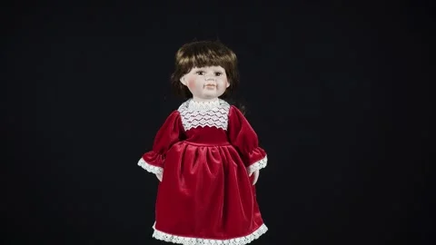 Red Haired Rotating Antique Doll In Red Dress On Black Background. Stock Footage 290390861