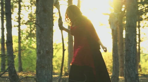 Red-haired witch walking in forest Stock Footage 55815946