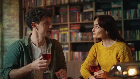 Red-haired woman and boyfriend enjoying romantic cafe date while drinking wine Stock Footage 340266889