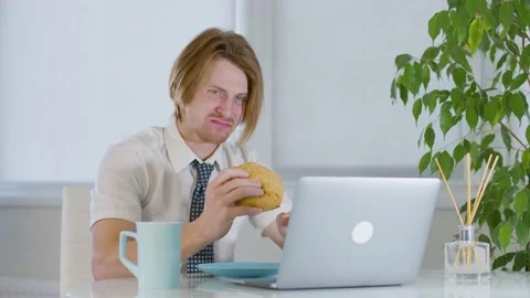 Red-haired young male worker office.not good lunch.not tasty.disgusting food Stock-Footage 239271936