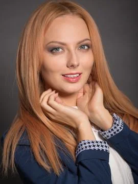 Red haired young model posing in studio Stock Photos