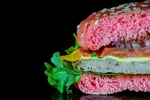 Red hamburger on a black background macro Photos