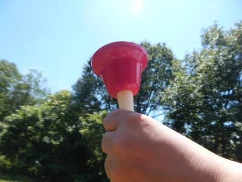 Red Hand Bell Stock Photos