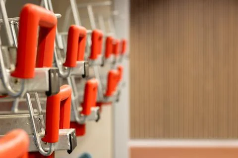 Red handles of elevated, multiple bicycle stands Stock Photos