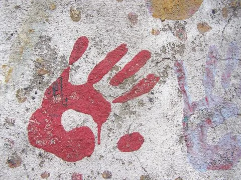 Red handprint on wall Stock Photos