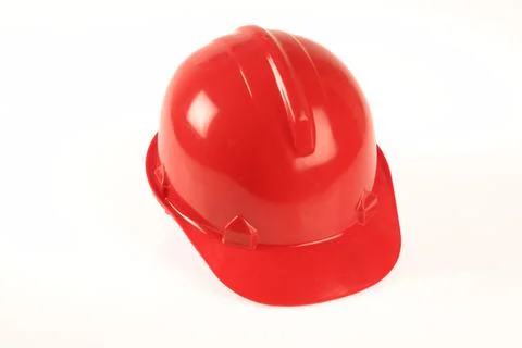 A red hard hat as used on construction sites, on a white background. Stock Photos
