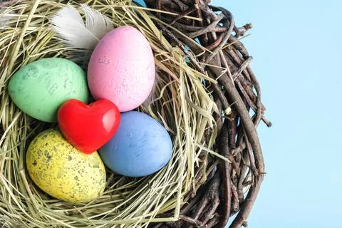 Red heart and easter egg nest flatlay. Stock Photos