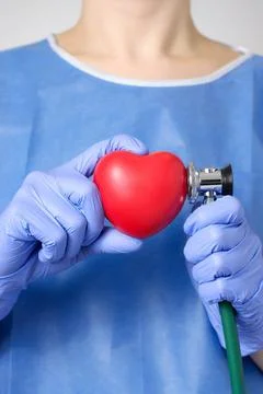 Red heart and stethoscope in the hand of a doctor Red heart and stethoscop... Stock Photos