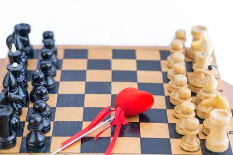 Red heart between two components of chess Stock Photos