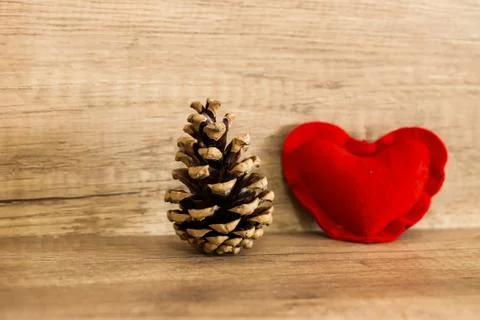 Red heart bump rustic decor base placed on a wooden background Stock Photos