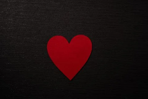 Red Heart centered on black background Stock Photos