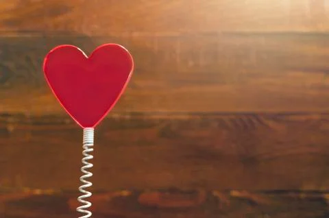Red Heart On Coil Spring. Rustic Wooden Background. Saint Valentines Day Stock Photos