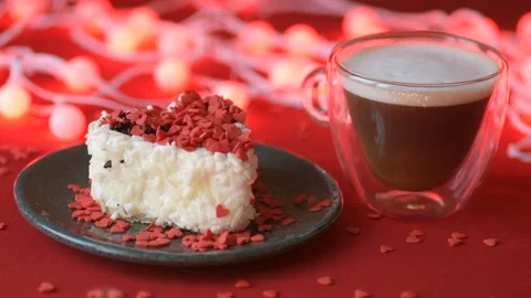 Red heart confetti fall on green cover white cakes Stock Footage 147367265