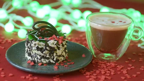 Red heart confetti fall on green cover white cakes Stock Footage 147367294