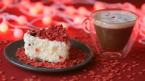 Red heart confetti fall on green cover white cakes Stock Footage 147367385