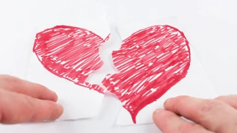 Red heart cut in half. Lost love concept. Parting, romantic relationship. Stock Footage
