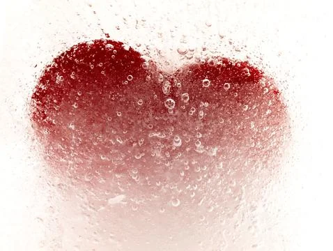 Red heart embedded in ice. Stock Photos
