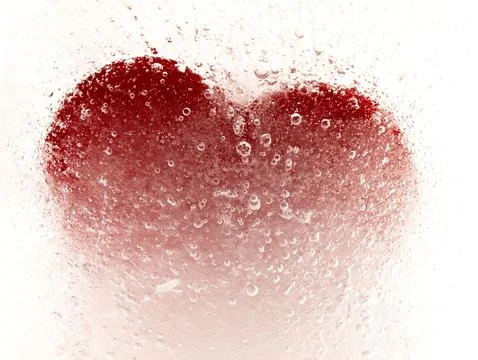 Red heart embedded in ice. Stock Photos