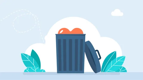 Red heart falls into trash can. There is an open trash can, the lid lies nearby Stock Footage 277948885