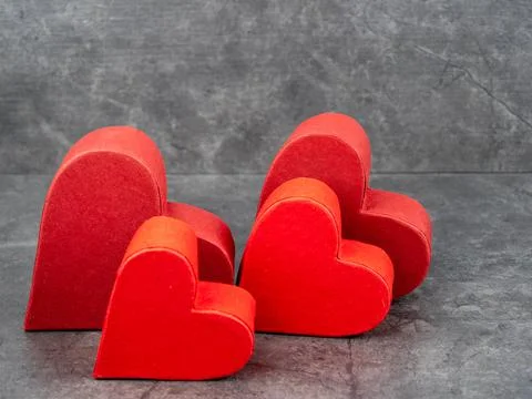 Red heart on a gray background. Stock Photos