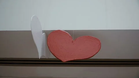 Red heart hanging on the ceiling Stock Footage 104113438