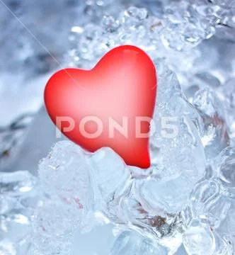 Red heart in ice Stock Photos