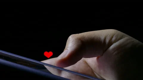 Red heart icon float on smartphone thumb finger play touch screen social network Video stock 135397558