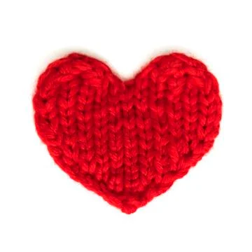 Red heart knitted from threads on a white background Stock Photos
