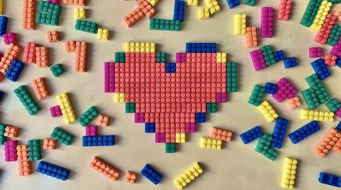 Red heart made from a children's constructor with a pixel art Stock Photos