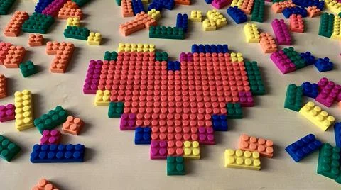 Red heart made from a children's constructor pixel art Stock Photos