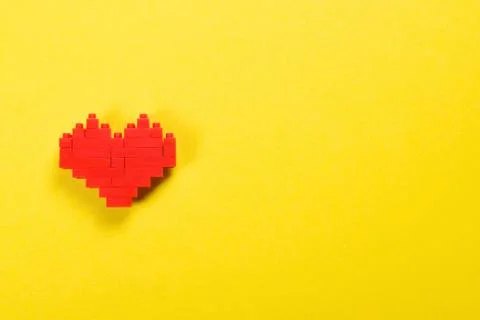 Red heart made of constructor blocks. Stock Photos