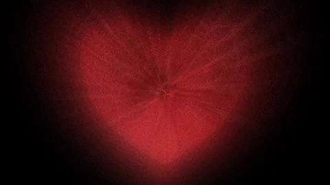 Red heart made of small particles on a black background. 库存影片 263615531