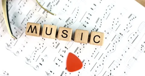 Red heart on musical notes and text music closeup Stock Footage 219928618