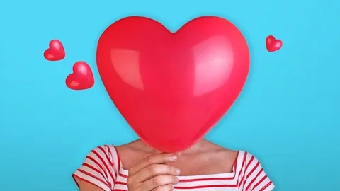 Red heart over face Stock Footage