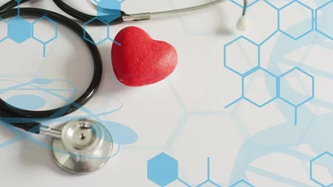 Red heart prop anchoring as camera drifting revealing hexagon with stethoscope Stock Footage 334883996