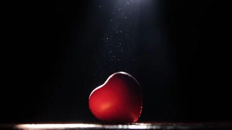Red heart in a ray of light Видео 258840239