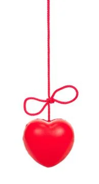 Red heart on a rope with a bow Stock Photos