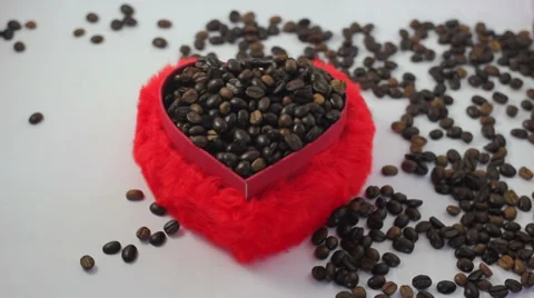 Red heart shape box and spilling coffee beans Stock Footage 37206950