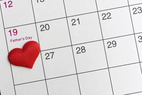 Red heart shape on the date of the 19th day in the calendar. Stock Photos