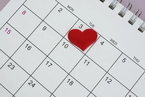 Red heart shape on the date of the 3rd day in the calendar. Stock Photos
