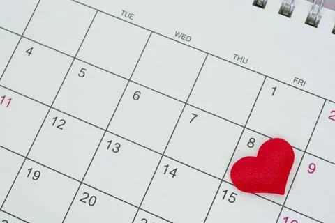 Red heart shape on the date of the 8th day in the calendar. Stock Photos