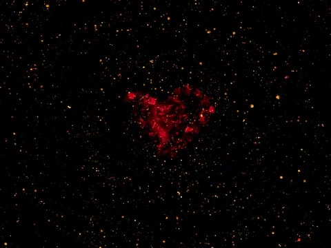Red heart shape forming from glowing particles Stock Footage 327169169