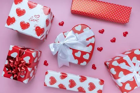 Red heart shape Gift or present box, mini heart on pink background. for banne Stock Photos
