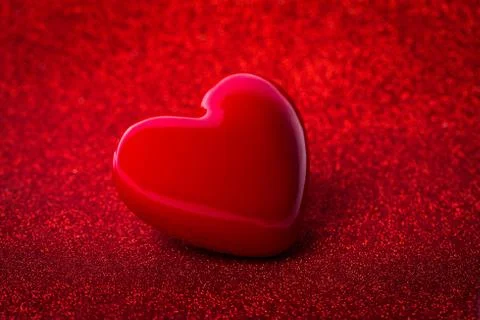 The red Heart shape on red abstract light glitter background in love concept  Stock Photos