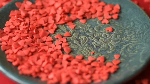 Red heart shaped confetti fall cover green plate Stock Footage 146751916