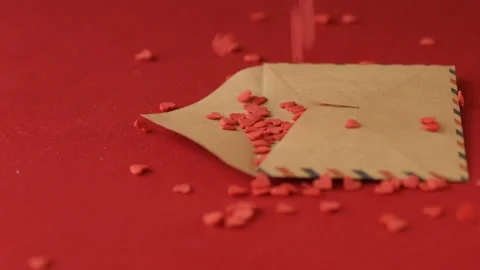 Red heart shaped confetti fall in valentine card Stock Footage 147032477