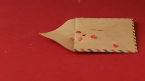 Red heart shaped confetti fall in valentine card. Stock Footage 147032544