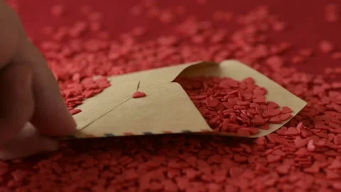 Red heart shaped confetti fall in valentine card Stock Footage 147032907