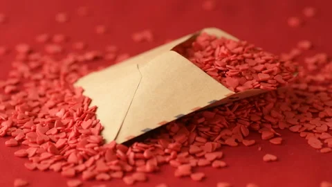 Red heart shaped confetti fall out valentine card Stock Footage 147033324