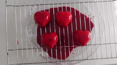 Red heart-shaped cupcakes on the grid Stock Footage 308226128
